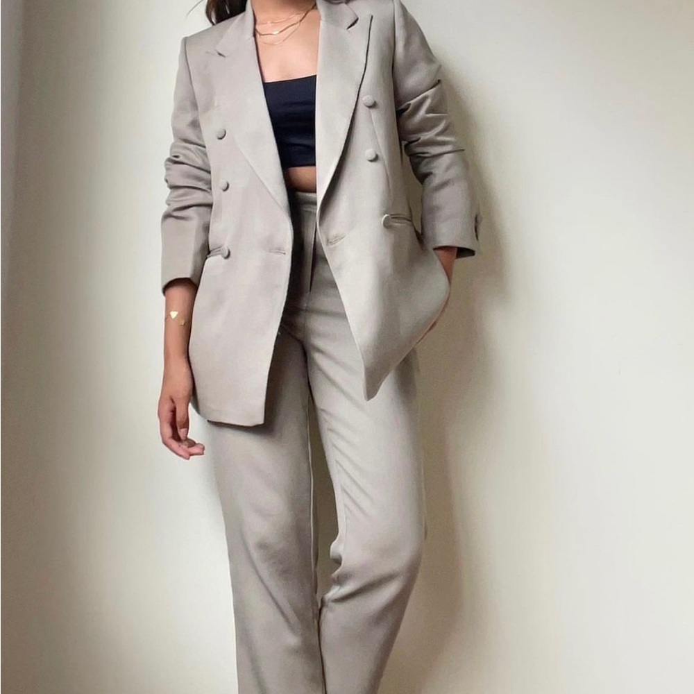 Tailor made suit with smart ankle length pants and a double breasted blazer.